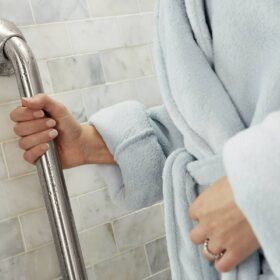 Woman-holding-onto-shower-grab-bar